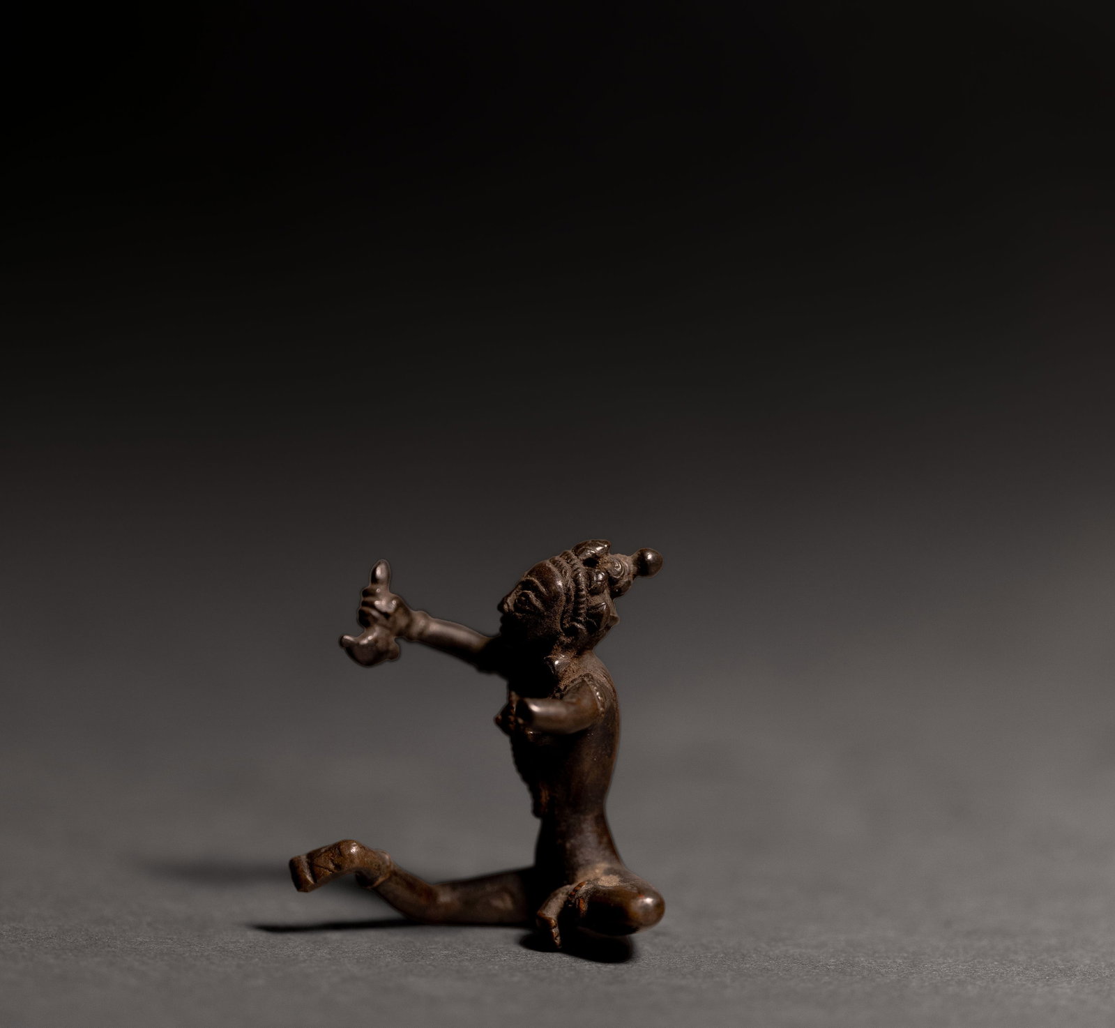 Indian Bronze Figure, Possibly Vajrapani (Chakna Dorje), 16th?18th C.: Small Indian bronze figure, 16th-18th century. A possible depiction of Vajrapani, a powerful protective bodhisattvas in Mahayana and Vajrayana Buddhism. The bodhisattva is shown seated with one arm
