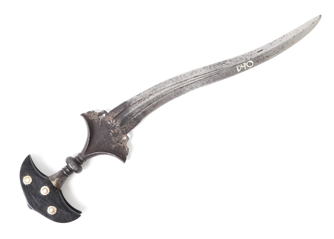 Indian Chilanum Dagger, 17th/18th C.: 17th/18th century Indian Chilanum dagger with a recurved blade. Pair of fullers to the lower half of the blade converging at the forte which is decorated with silver koftgari flowers and foliage.
