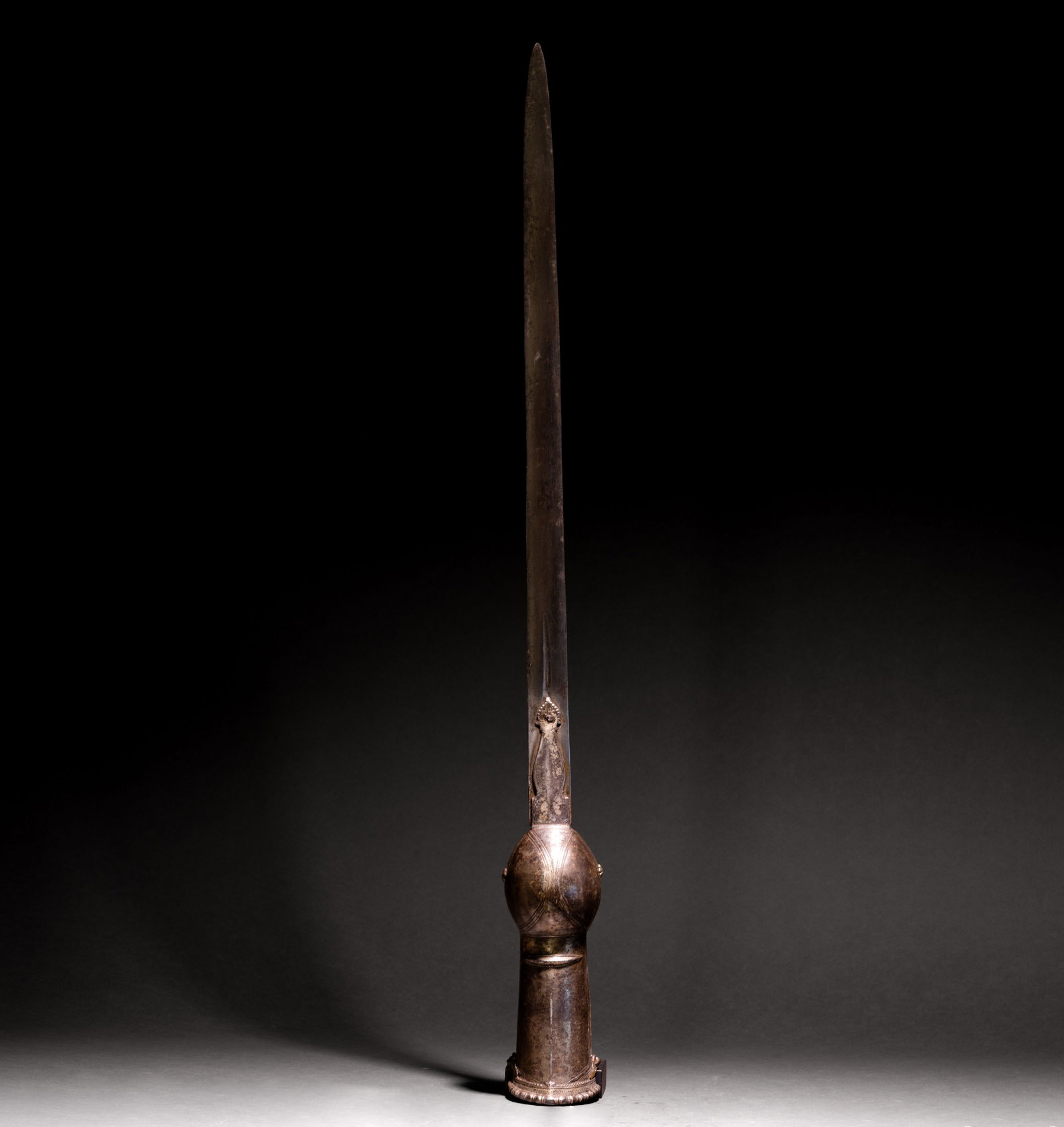 Indian Pata Gauntlet Sword w/ Scabbard, 18th C.: Indian pata, or gauntlet sword, 18th century, with a long straight double edged steel blade mounted to a metal gauntlet hilt. The hilt has a rounded hand guard, extended forearm cuff, raised bands,