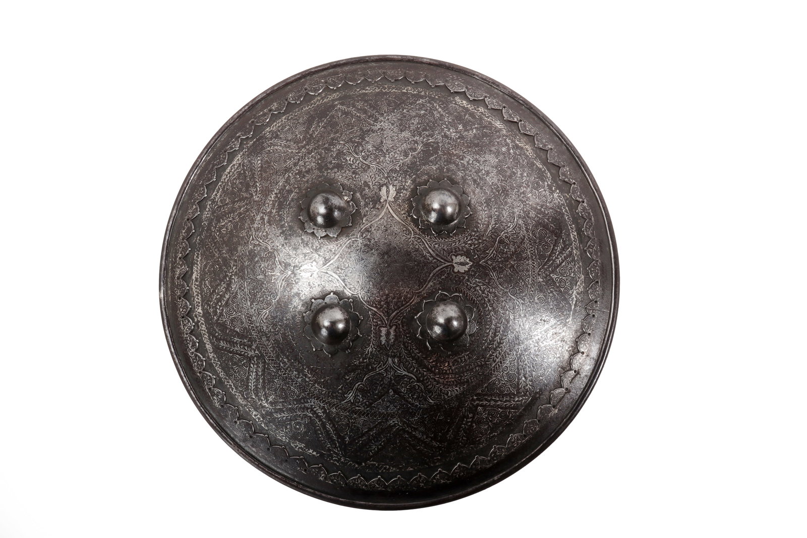 Indo-Persian Steel Koftgari Shield, 19th C.: Indo Persian, 19th century. Heavy circular steel shield with four raised bosses covering the fixing points, a heavy rim, and a serrated border around the face. The surface is acid etched with dense fl