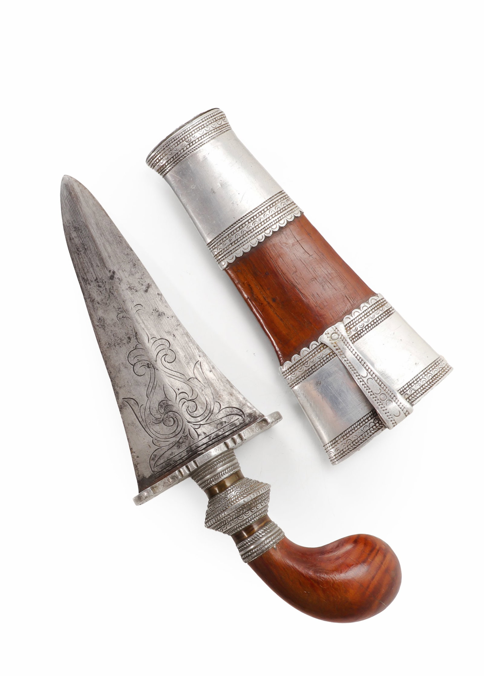 Philippine Moro Damascus Punal Dagger, Early 20th C.: Philippines, likely Mindanao or Sulu region, early 20th century. A small Moro punal or gunong dagger with a broad double edged Damascus steel blade, the blade decorated with incised scrolling foliate 
