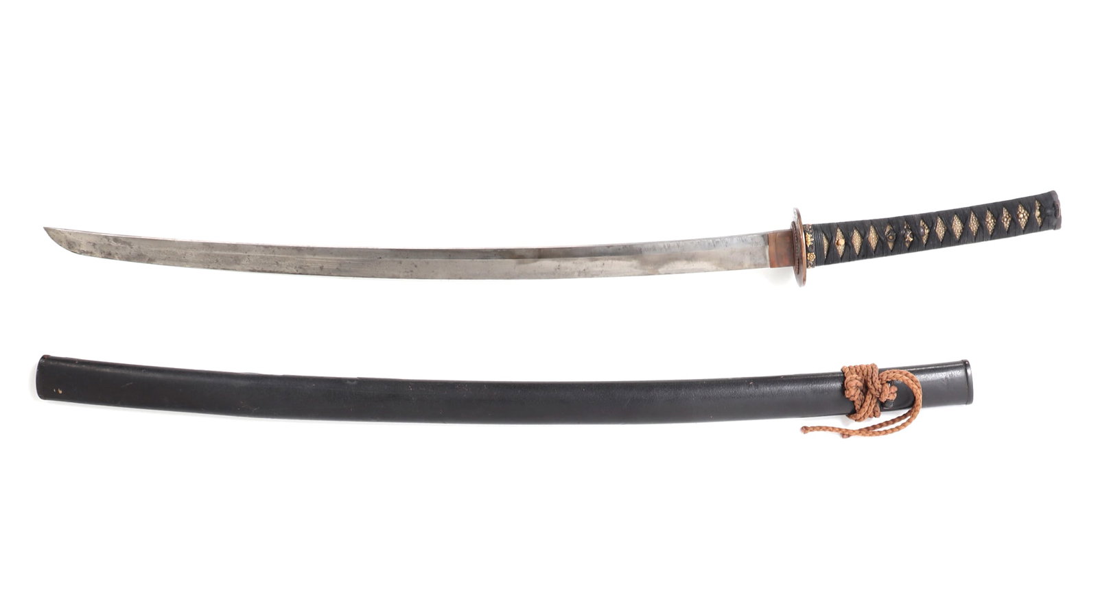 Japanese Shinto Period Katana: Japanese katana and scabbard of the Shinto period circa 1680. Gilt floral designs to kashira and fuchi. Tusba with incised bamboo decoartions. Tang unsigned. Size 41 1/2" L, blade 24 3/4" L.