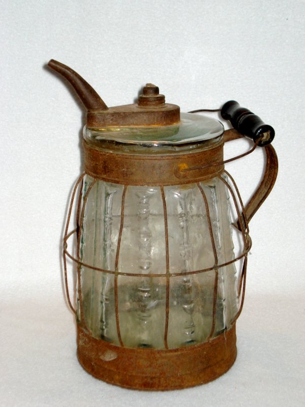 Glass kerosene container, colorless, notched rib (1 of 4)