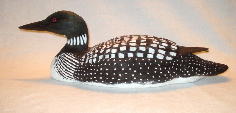 Carved and painted wooden loon decoy. (1 of 8)