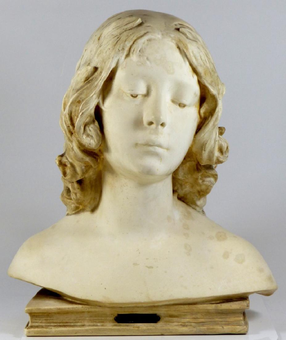 JULIEN CAUSSE PARIAN PORCELAIN BUST "POESIE": Parian porcelain bust after Julien Causse (French, 1869-1914). Depicts the bust of a girl atop a book. Titled "Poesie" to front plaque. Signed "J. Causse" to back. Measures 14 1/2" (37cm) height x 13