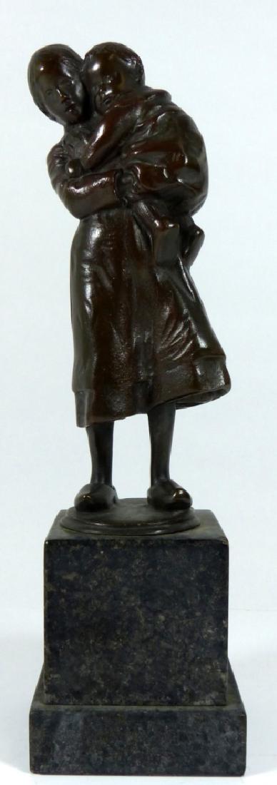 GUSTAV SCHNIDT-CASSEL BRONZE OF MOTHER & CHILD: Gustav Schmidt-Cassel (German, b. 1867) bronze sculpture depicting a woman holding a young boy. Signed to side of bronze base. Measures 6 1/2" (16.5cm) + 3" (7.5cm) marble base.