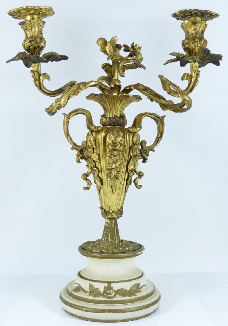 GILT BRONZE 2-LIGHT CANDELABRUM: Gold gilt bronze candelabra, each arm having spiral design and floral motif throughout. Measures 18" (46cm) height.