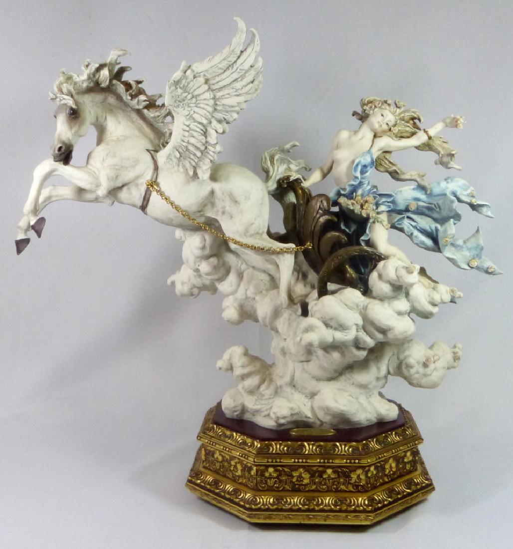 GIUSEPPE ARMANI 'AURORA' PORCELAIN FIGURINE w BOX: Giuseppe Armani 'Aurora' porcelain figure #0680-C with original box. Depicts a nude woman in chariot being pulled by a winged horse. Numbered 1117/1500. Signed to front and Capodimonte crown mark to b