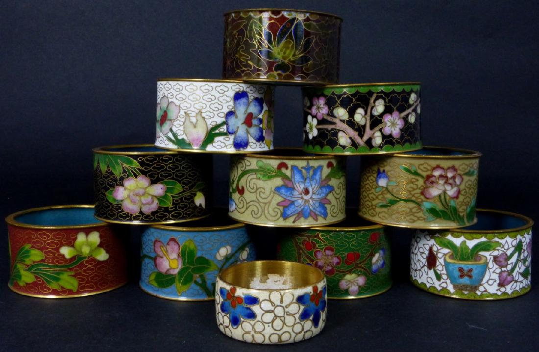 10pc CHINESE CLOISONNE NAPKIN RINGS: 10 Chinese cloisonne napkin rings in various colors, each having a blue enameled interior. Each measures 2" (5cm) diameter.
