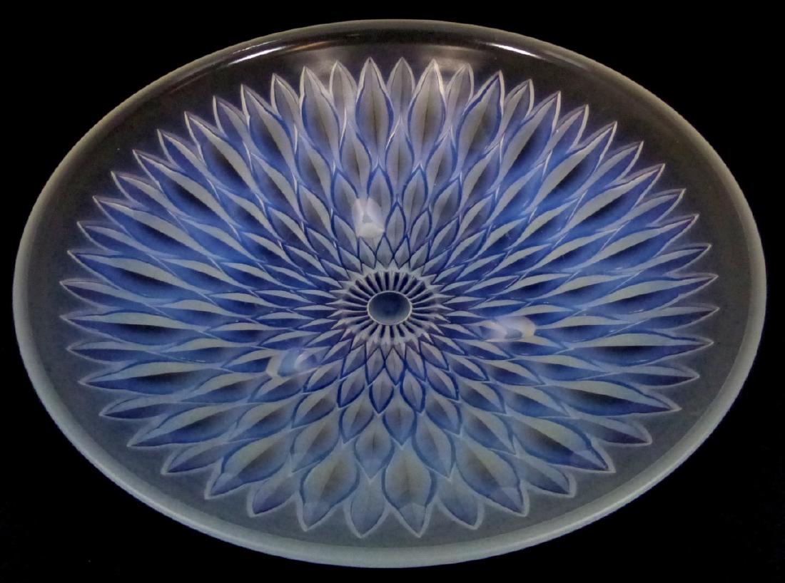 R. LALIQUE OPALESCENT GLASS BOWL: R. Lalique opalescent art deco glass bowl with stylized flower design and molded glass feet. Signed to outside of rim. Measures 11 3/4" (30cm) diameter.