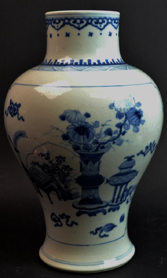 18th/19th C CHINESE BLUE & WHITE PORCELAIN VASE: 18th/19th century Chinese blue and white porcelain vase with depiction of a landscape to one side and decorative objects to opposite side. Scrolled cloud design around rim with geometric design below.