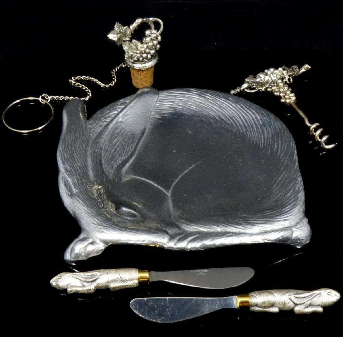 5pc ARTHUR COURT METAL TABLE ITEMS: Arthur Court rabbit tray. Signed to underside and dated 1988. Measures 8 1/2" (21.5cm) width. 2 Arthur Court bunny butter knives and a corkscrew and wine bottle cork with leaf and grape motif.
