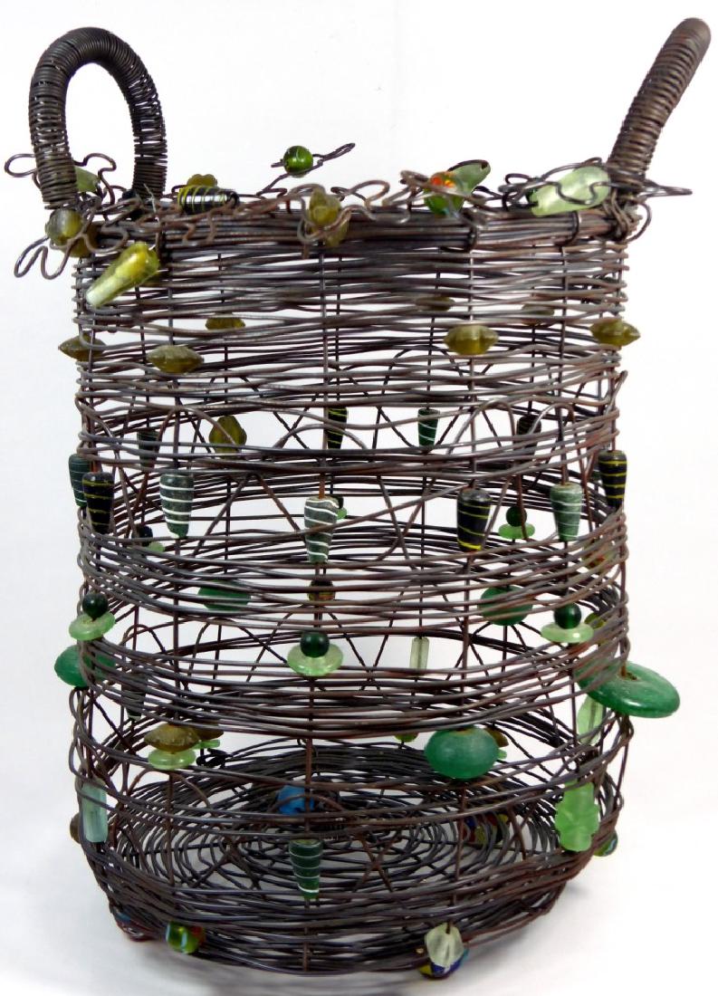 SALLY PRANGLEY STEEL WIRE & GLASS BEAD BASKET: Sally Prangley handled basket consisting of steel wire and glass beads having four spherical millefiori feet. Measures 16 1/2" (42cm) height.