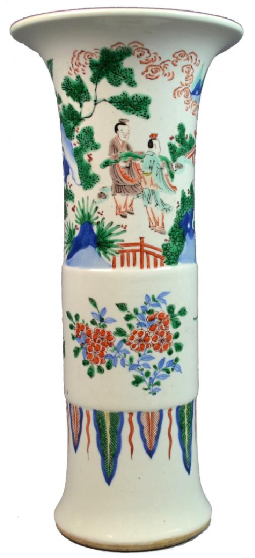 18th C CHINESE FAMILLE VERTE PORCELAIN BEAKER VASE: Early 18th century Chinese Famille Verte porcelain Gu form beaker vase having floral sprays and depictions of figures. Measures 18" (45.5cm) height.