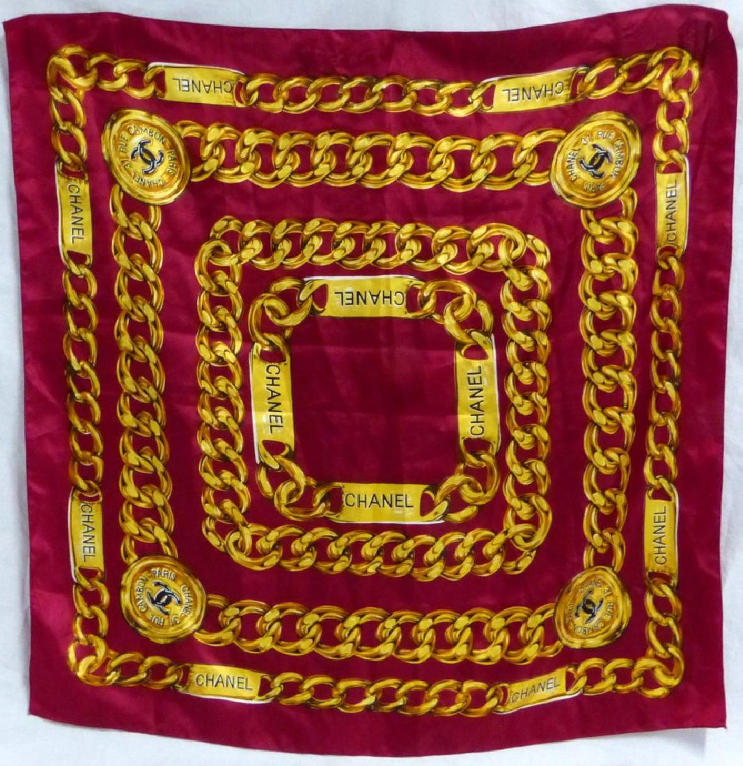 CHANEL PARIS GOLD CHAIN SILK SCARF: Chanel sink scarf with depictions of gold chains over a burgundy ground. Measures 34" (86cm) square.