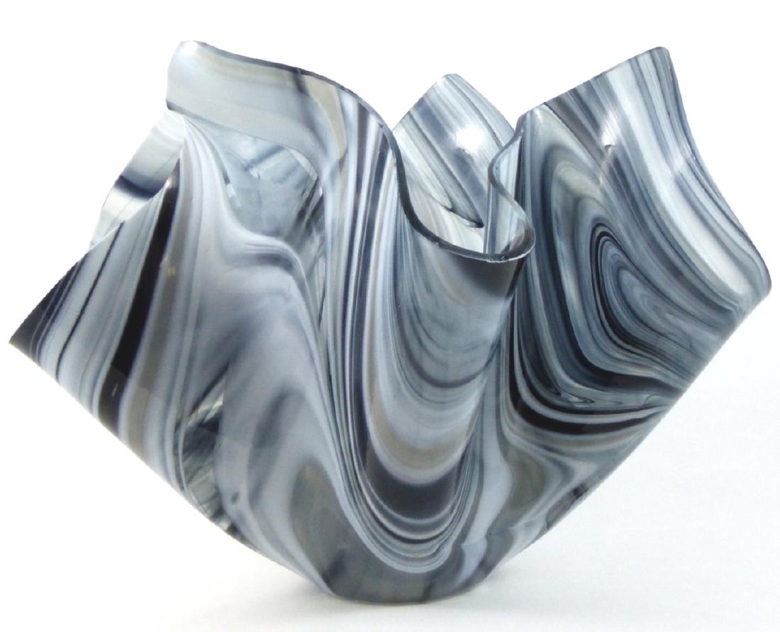 STUDIO ART GLASS HANDKERCHIEF VASE SIGNED: Studio art glass handkerchief vase of freeform design. Smokey grey in color. Signed to underside. Measures 9" (23cm) width x 7" (18cm) height.