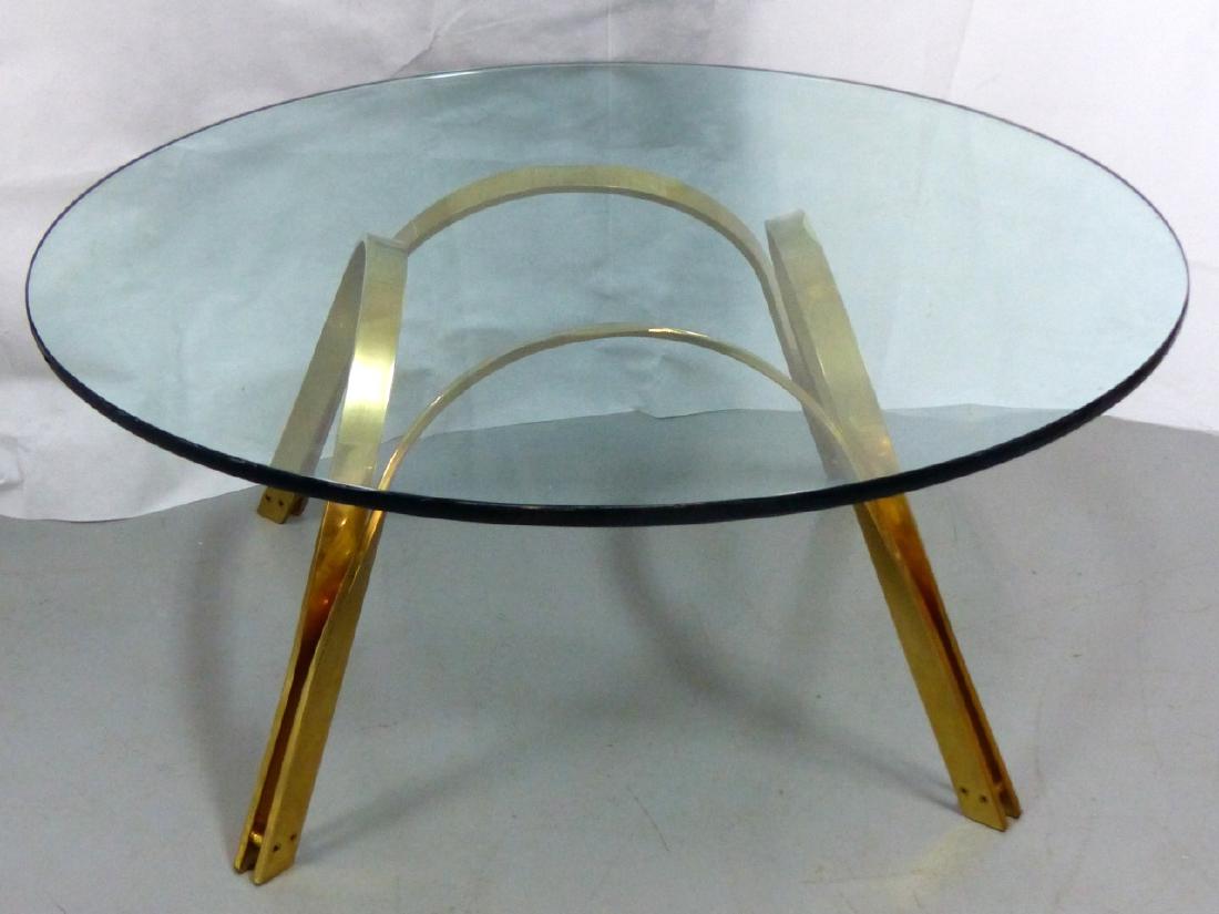 ROGER SPRUNGER FOR DUNBAR BRASS COFFEE TABLE: Roger Sprunger for Dunbar mid-century modern glass top polished brass coffee table. For use with its legs facing up or down. Base measures 27 1/2" (70cm) square. Glass top measures 42" (106.5cm) diame