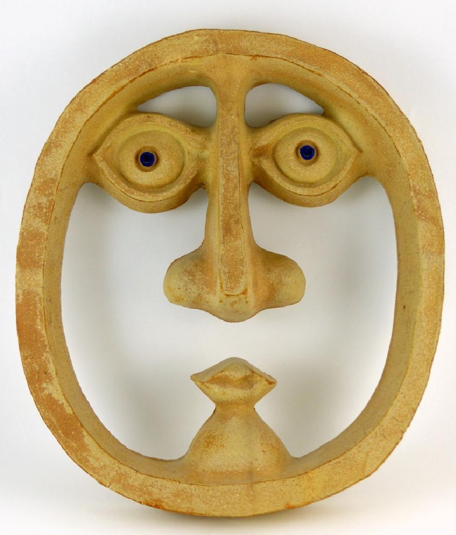 BENNINGTON POTTERY DAVID GIL MASK PLAQUE: Mid-century David Gil for Bennington Potters art pottery plaque in the form of a face. Impressed to backside. Measures 14" (35.5cm) height.