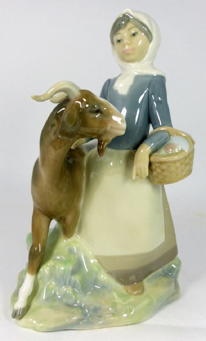 LLADRO 'GIRL WITH GOAT' PORCELAIN FIGURINE: Lladro 'Little Girl with Goat' porcelain figure #4812 depicts a girl holding a basket with goat. Marked to underside. Measures 8 1/2" (21.5cm) height.