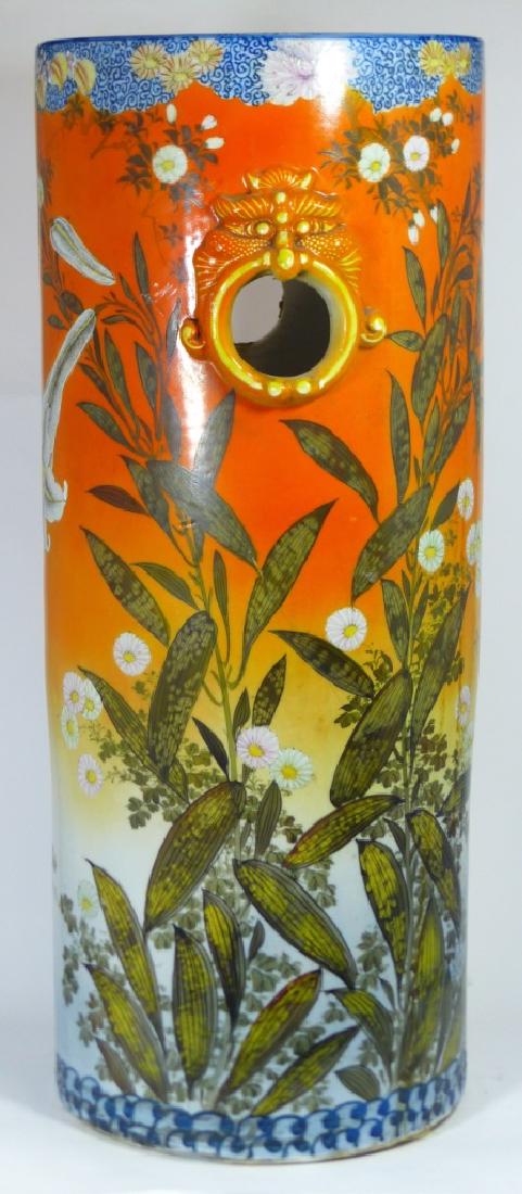 ANTIQUE JAPANESE PORCELAIN UMBRELLA STAND: Antique Japanese porcelain umbrella stand decorated with floral motif and having two mask form handles. Marked to underside. Measures 24 1/2" (62cm) height.