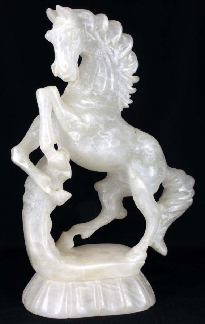 CARVED ALABASTER REARING HORSE: Carved alabaster sculpture depicting a rearing horse. Measures 16" (40.5cm) height.