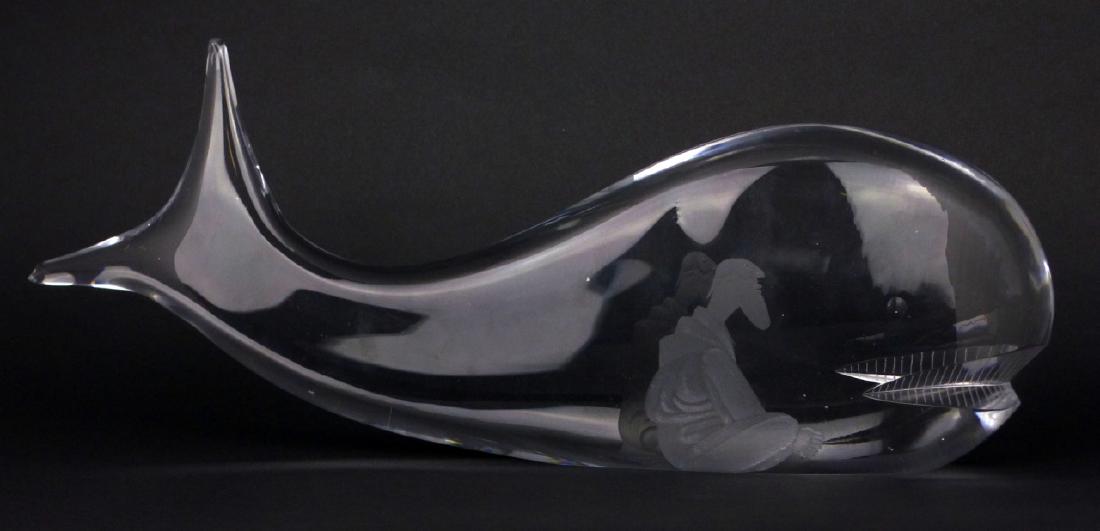 VICKE LINDSTRAND KOSTA BODA GLASS WHALE SCULPTURE: Vicke Lindstand for Kosta Boda crystal sculpture depicting Jonah and the whale. Signed to underside and numbered 92407. Measures 13 1/2" (34cm) length.