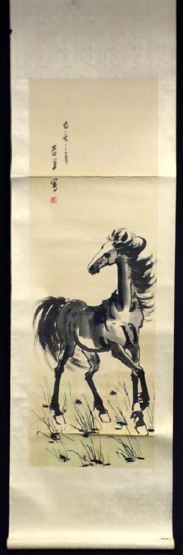 CHINESE SCROLL PAINTING OF HORSE SIGNED: Chinese watercolor scroll painting depicting a horse. Signed upper left. Painting measures 35" (89cm) x 11 1/2" (29cm) excluding mat. Roller measures 15" (38cm) length.