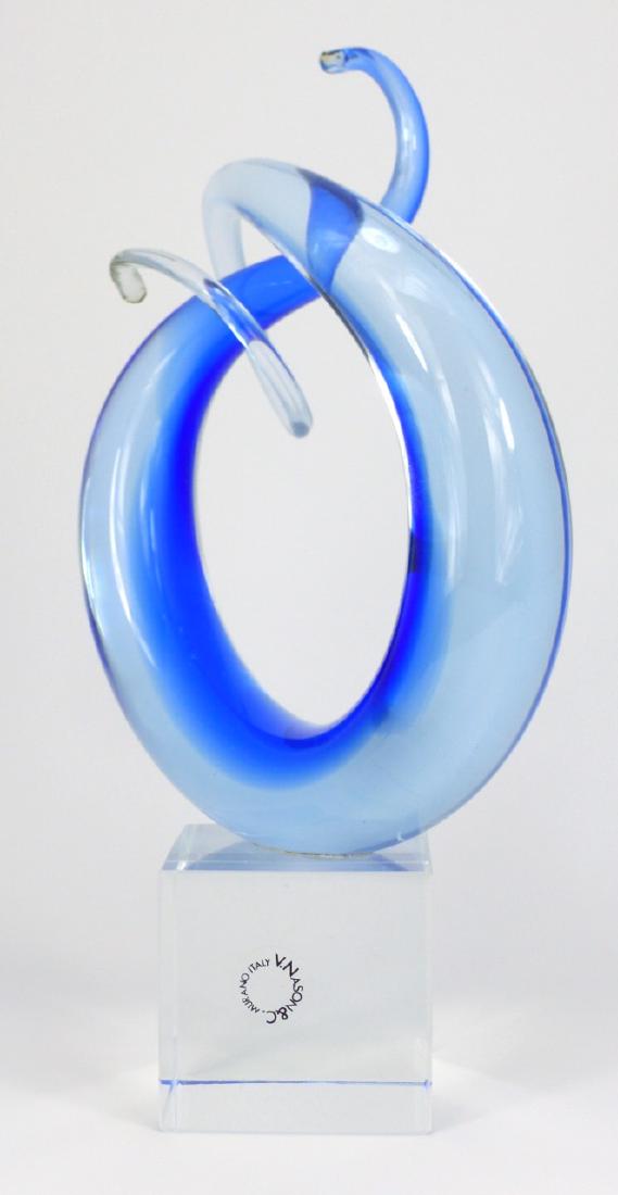 VINCENZO NASON MURANO GLASS FREEFORM SCULPTURE: Vincenzo Nason Murano art glass freeform sculpture on a colorless base of cubical form. Signed to side of base and holds original label. Measures 9 7/8" (25cm) height.
