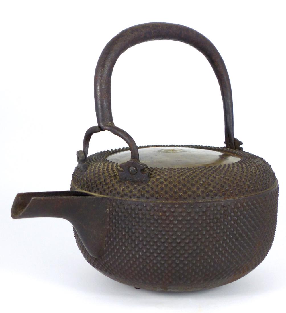 JAPANESE CAST IRON HOBNAIL TEA KETTLE: Chinese cast iron teapot with hobnail design. Measures 8 1/2" (21.5cm) width x 8 1/4" (21cm) height.