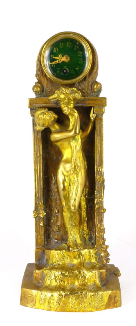 CHARLES KORSCHANN NOUVEAU BRONZE CLOCK: Charles Korschann (Czech / French / German, 1872-1943) Art Nouveau gilt and patinated bronze clock. Depicts a nude Nouveau maiden standing atop three steps bathing with water flowing from the mouth of