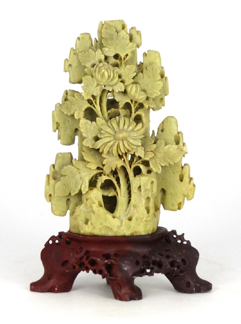 CHINESE CARVED SOAPSTONE FLORAL SCULPTURE: Chinese soapstone carving of blossoms and foliage mounted on a hardstone base. Measures 5 1/2" (14cm) + 1 5/8" (4cm) base.