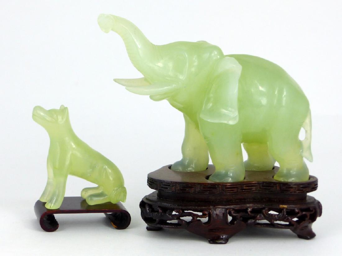 2pc CHINESE CARVED SERPENTINE JADE ELEPHANT & DOG: 2 Chinese serpentine jade carvings including an elephant and seated dog. Elephant measures 4 1/2" (11.4cm) length.