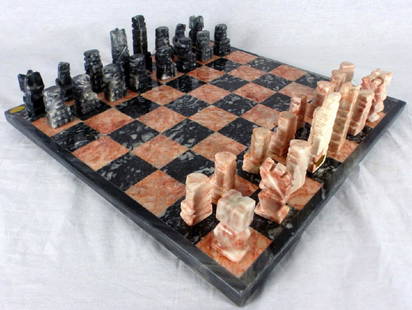 MEXICAN HAND CARVED ONYX CHESS SET: Mexican hand carved pink and grey onyx chess set. Includes board and 32 pieces. Board measures 13 5/8" (34.5cm) square.