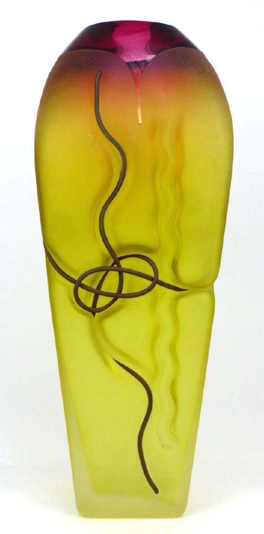 JIM & CONNIE GRANT STUDIO ART GLASS VASE: Jim & Connie Grant studio art glass vase having a magenta rim graduating to gold body with inset freeform linear decoration. Signed to underside and dated 2004. Measures 14" (35.5cm) height.