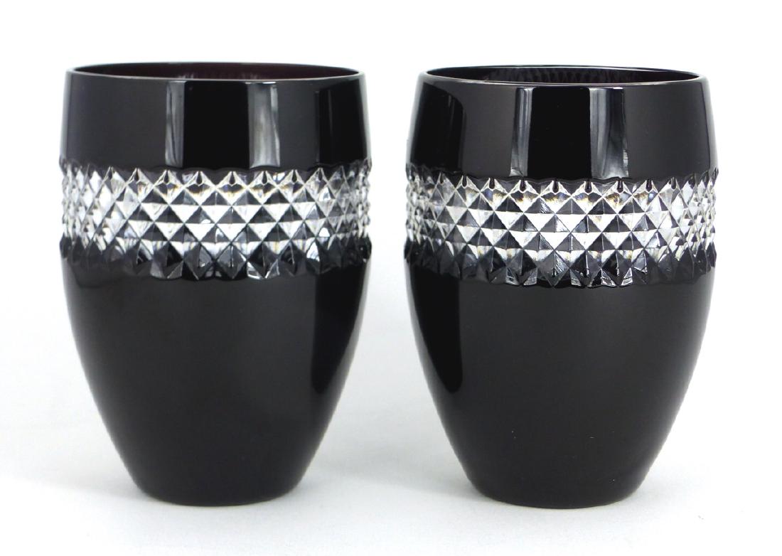 2pc JOHN ROCHA WATERFORD BLACK CUT TUMBLERS: 2 John Rocha for Waterford black cased crystal tumblers with clear cut pattern. Each marked to underside and measures 4 1/2" (11.4cm) height.