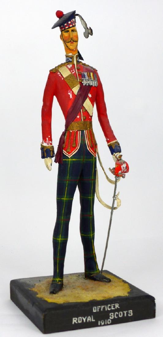 CLIFF ARQUETTE ROYAL SCOTS OFFICER: Cliff Arquette aka Charlie Weaver (American,1905-1974) carved and polychrome sculptural wood (with metal accessories) military figure depicting an officer from the Royal Scots, 1910. Inscribed to fron