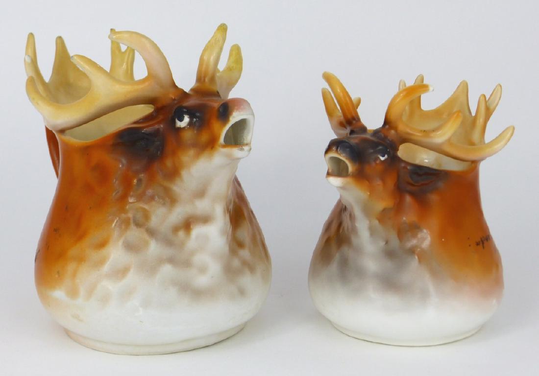 2pc ROYAL BAYREUTH FIGURAL ELK CREAMERS: 2 Royal Bayreuth porcelain creamers each in the form of an elk or moose. Each marked to underside. Largest measures 6 1/2" (16.5cm) length.