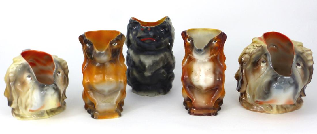 5pc ROYAL BAYREUTH FIGURAL DOG CREAMERS: 5 Royal Bayreuth figural porcelain creamers in the form of dogs. Includes 2 Saint Bernards, 2 Dachshunds and 1 poodle. Poodle impressed Deponart. One Dachshund marked. Other unmarked. Largest measures