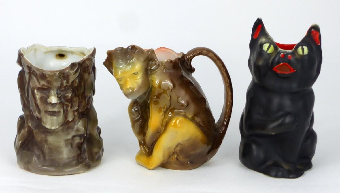 3pc ROYAL BAYREUTH FIGURAL CREAMERS: 3 Royal Bayreuth figural porcelain creamers including Monkey, Black Cat and Old Man of the Mountain. Cat marked to underside, others unmarked. Largest measures 5" (12.7cm) height.