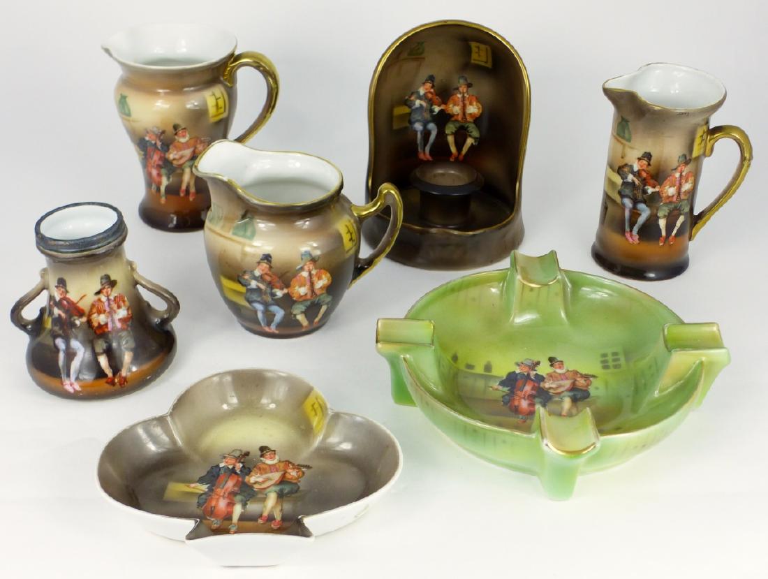 7pc ROYAL BAYREUTH SCENIC MUSICIANS PORCELAIN: 7 pieces of Royal Bayreuth porcelain with Musicians scenic decor. Includes 3 pitchers/creamers, 1 handled vase, 1 ashtray, 1 spade tray, 1 candlestick holder. Each marked to underside. Largest measure
