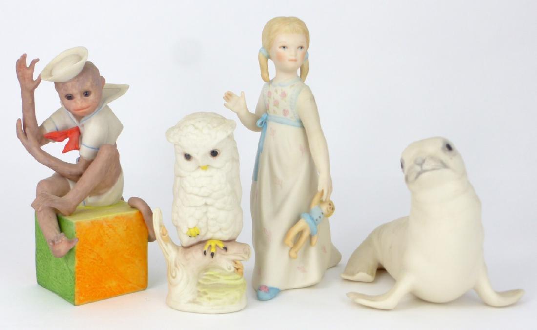 4pc CYBIS PORCELAIN FIGURINES: 4 Cybis porcelain figures including girl with doll, white baby seal, monkey sailor and perched owl. Each marked. Largest measures 6 1/2" (16.5cm) height.