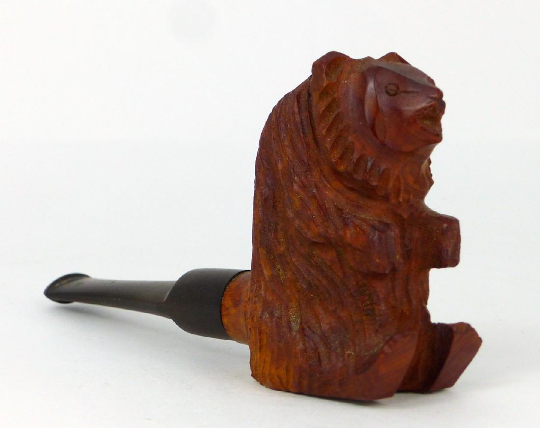 CARVED WOOD FIGURAL BEAR SMOKING PIPE: Wooden carved pipe in the form of a bear. Measures 5" (12.7cm) length x 3" (7.5cm) height.