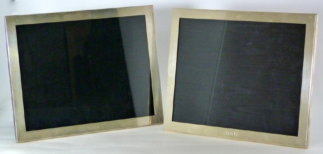 2pc TIFFANY & CO STERLING SILVER PICTURE FRAMES: 2 Tiffany & Company sterling silver picture frames. Each marked Tiffany & Co, 925 along back edge. Each measures 10" (25.5cm) x 8" (20.3cm).