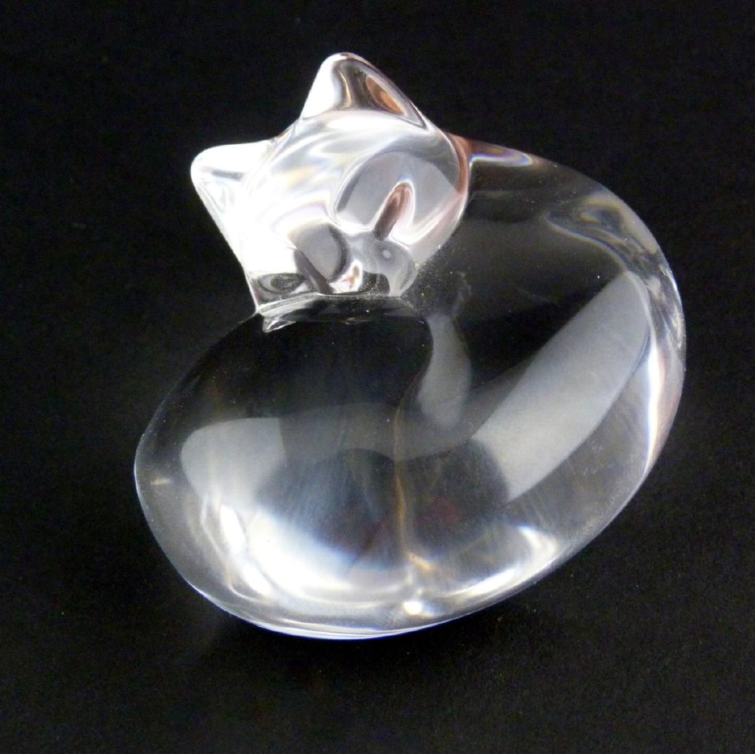 STEUBEN 'SLEEPING CAT' CRYSTAL HAND COOLER: Steuben crystal hand cooler in the form of a cat. Marked to underside. Measures 2 1/2" (6.3cm) length.