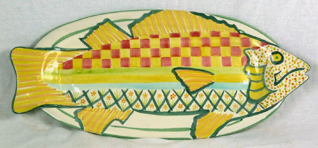 MACKENZIE CHILDS REDWARE FISH PLATTER: Mackenzie-Childs Redware pottery platter in the form of a fish. Hand painted in vibrant colors. Impressed to underside and holds original label. Measures 24 1/4" (61.3cm) length.