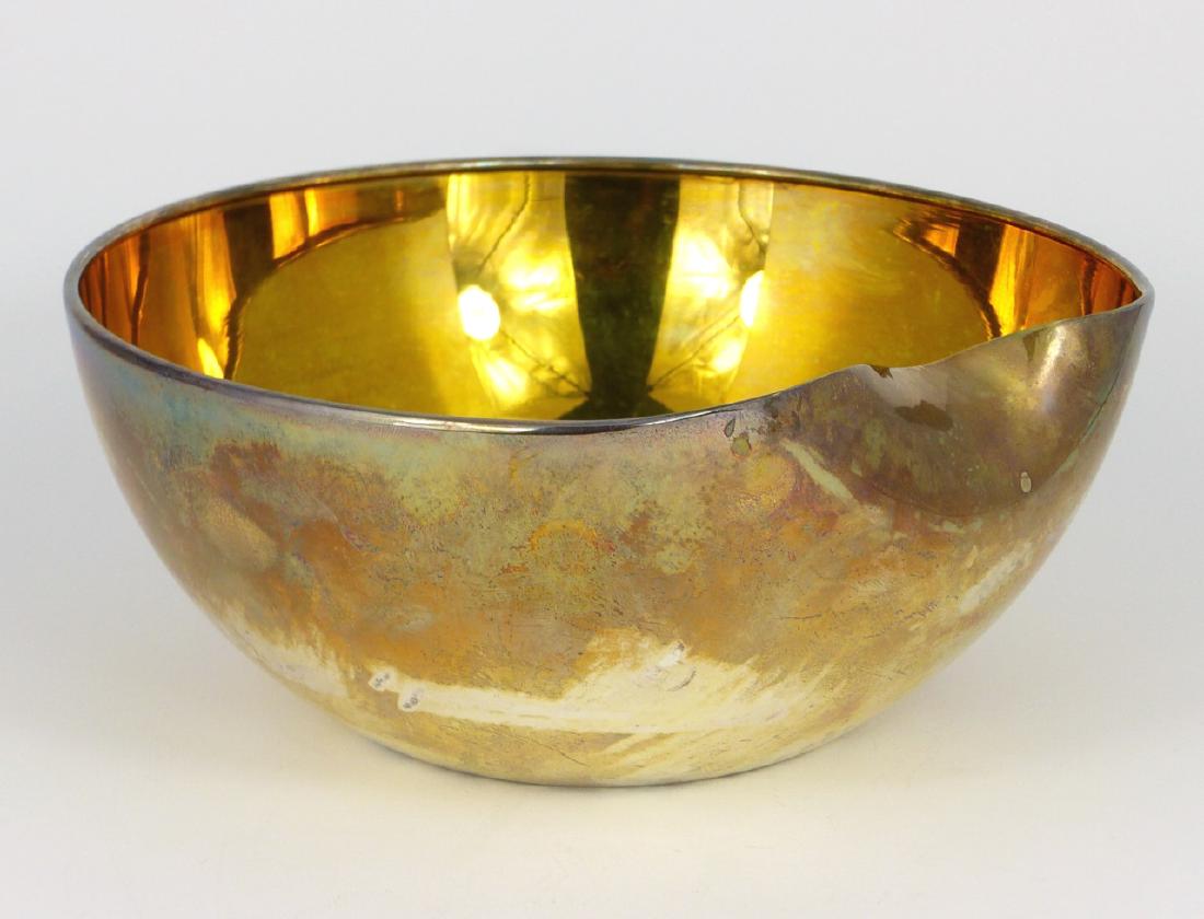 ELSA PERETTI FOR TIFFANY STERLING THUMBPRINT BOWL: Elsa Peretti for Tiffany & Company sterling silver bowl in the 'thumbprint' pattern with gold wash interior. Marked to underside E. Peretti, Tiffany & Co, Sterling, Italy. Measures 7 1/2" (19cm) width