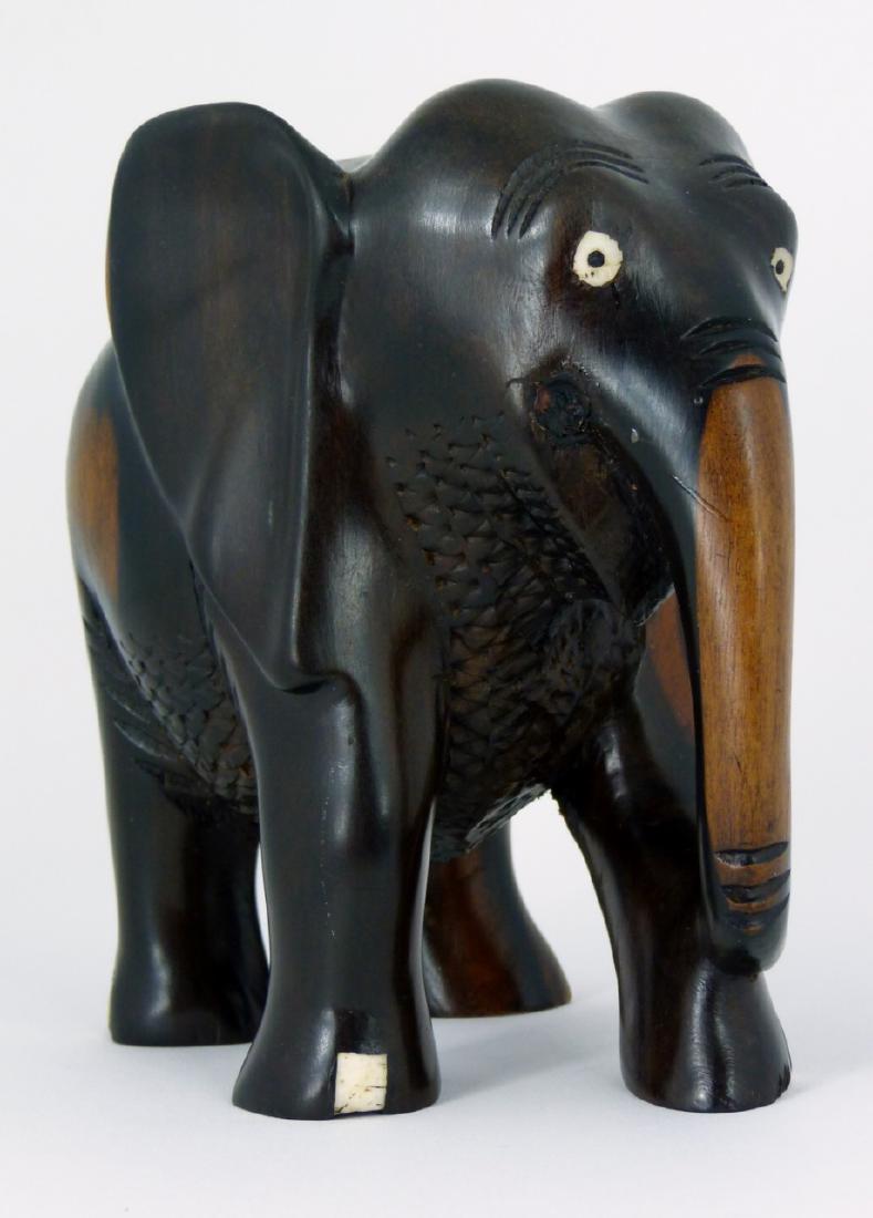 AFRICAN CARVED WOOD ELEPHANT: African carved wood elephant. Measures 5 1/2" (14cm) height and length.
