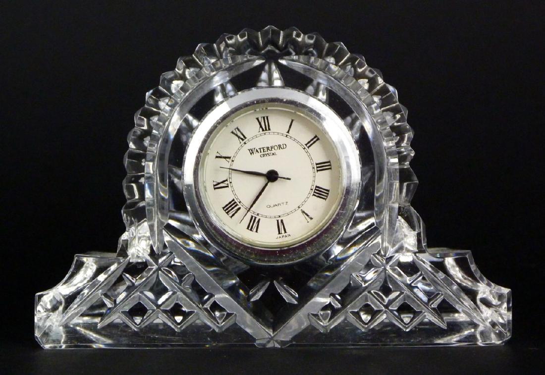 WATERFORD CUT CRYSTAL DESK CLOCK: Waterford cut crystal desk clock with quartz movement. Marked to face and underside of crystal. Measures 3 7/8" (9.8cm) width.