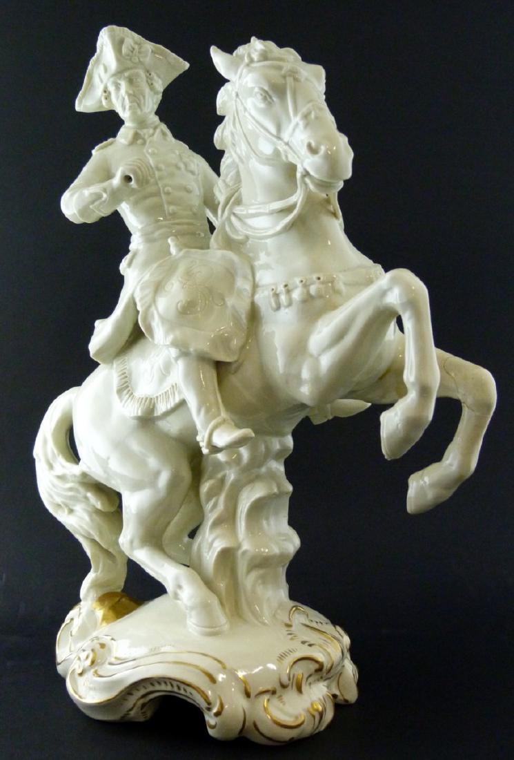 CAPODIMONTE PORCELAIN SOLDIER ON HORSEBACK: Capodimonte porcelain soldier on horseback. Holds Capodimonte mark. Measures 13 1/4" (33.5cm) height.