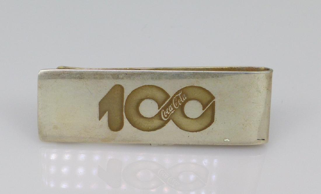TIFFANY & CO COCA-COLA STERLING SILVER MONEY CLIP: Tiffany & Co Coca-Cola 100 year anniversary sterling silver money clip. Marked Sterling, Tiffany & Co to underside. Measures 2 1/8" (5.5cm) length.